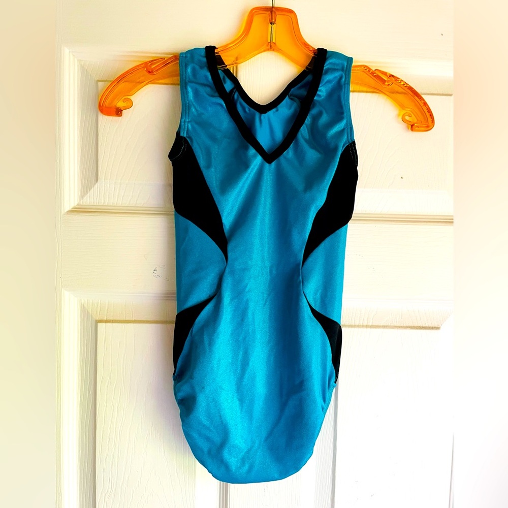 Under Amour size small gymnastics leotard w/assorted hair scrunchies.